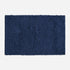 Navy blue cotton bath mat, tumble twist design.