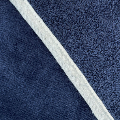 Navy blue towelling shower wrap with adjustable fit - soft and secure.