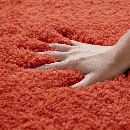 Super soft deep pile bath mat in terracotta burnt orange.