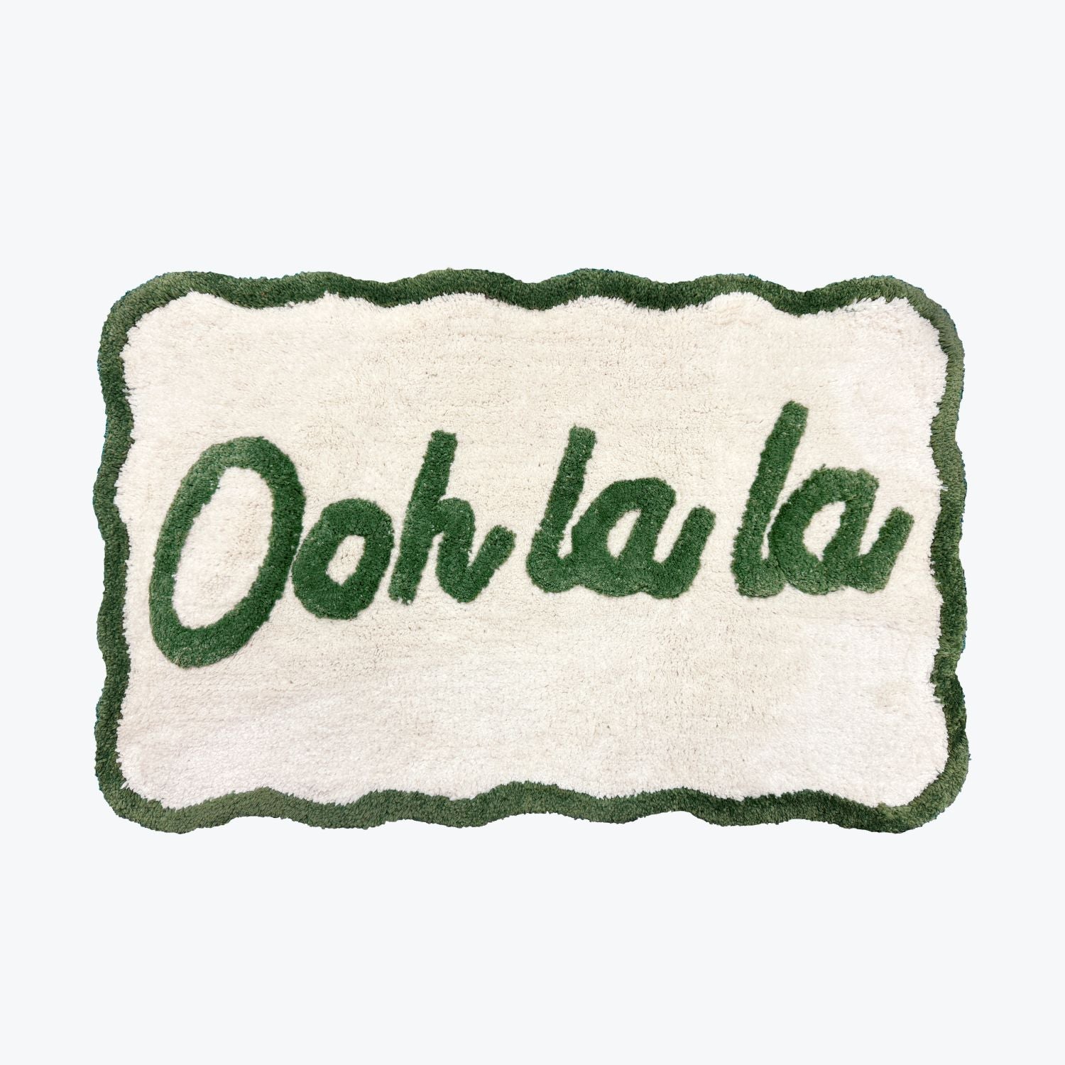 Ooh la la slogan mat with scallop edges in green and cream.