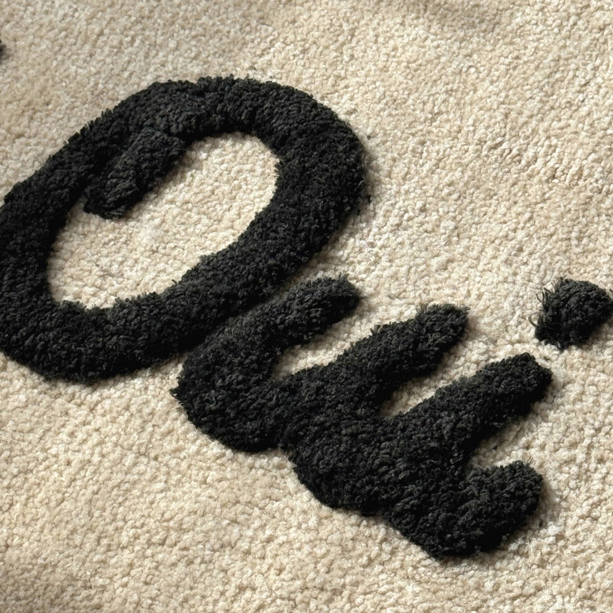 Oui Oui Slogan Scalloped Bath Mat