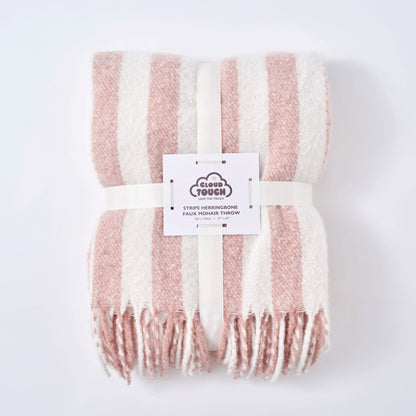 Pink striped herringbone blanket, neatly wrapped for gifting - cosy housewarming present.