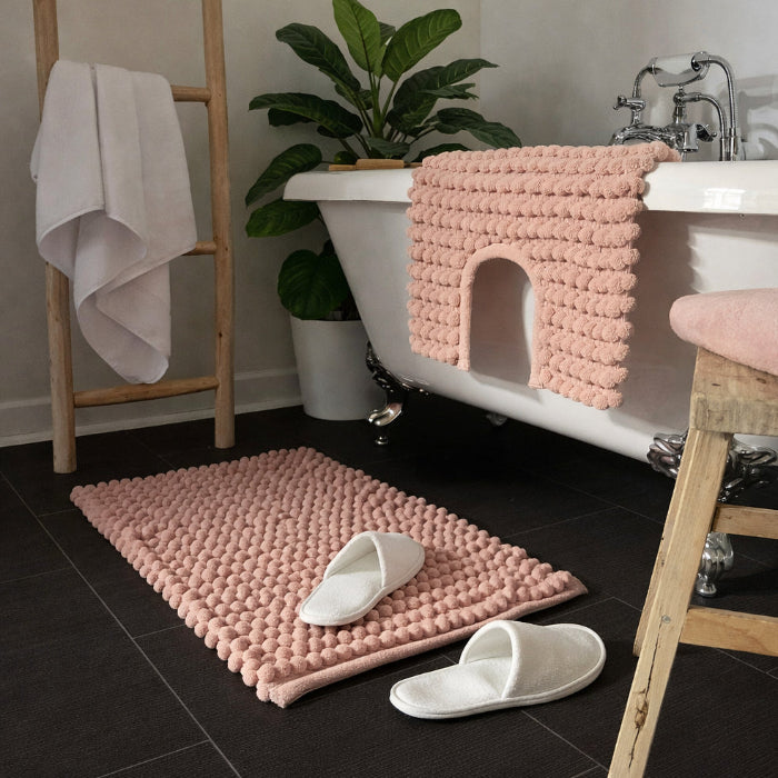 Blush pink bobble bath mat and pedestal mat.