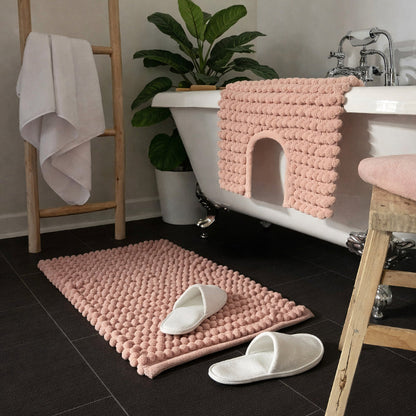 Blush pink bobble bath mat and pedestal mat.