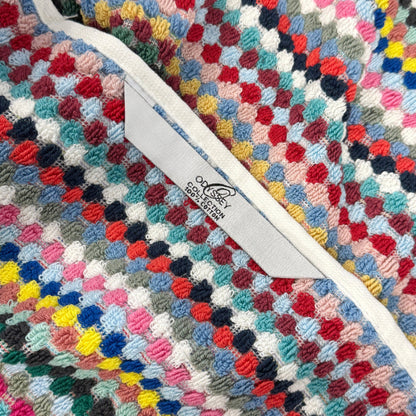 Colourful recycled cotton towels with hanging loop for quick drying.