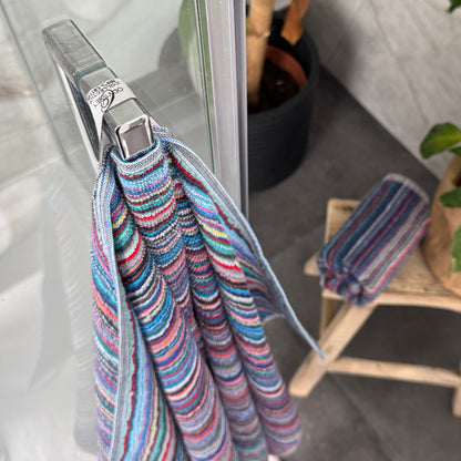 Colourful towels with hanging loops made from recycled cotton, sustainable alternative.