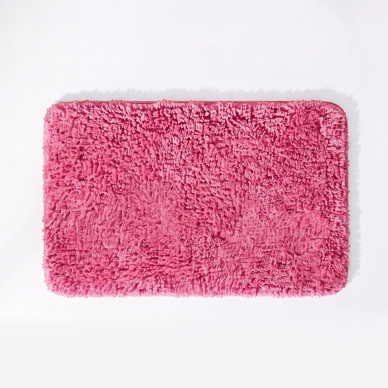 Rose pink non slip microfibre bath mat with deep shaggy pile.