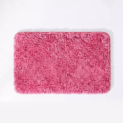 Rose pink non slip microfibre bath mat with deep shaggy pile.