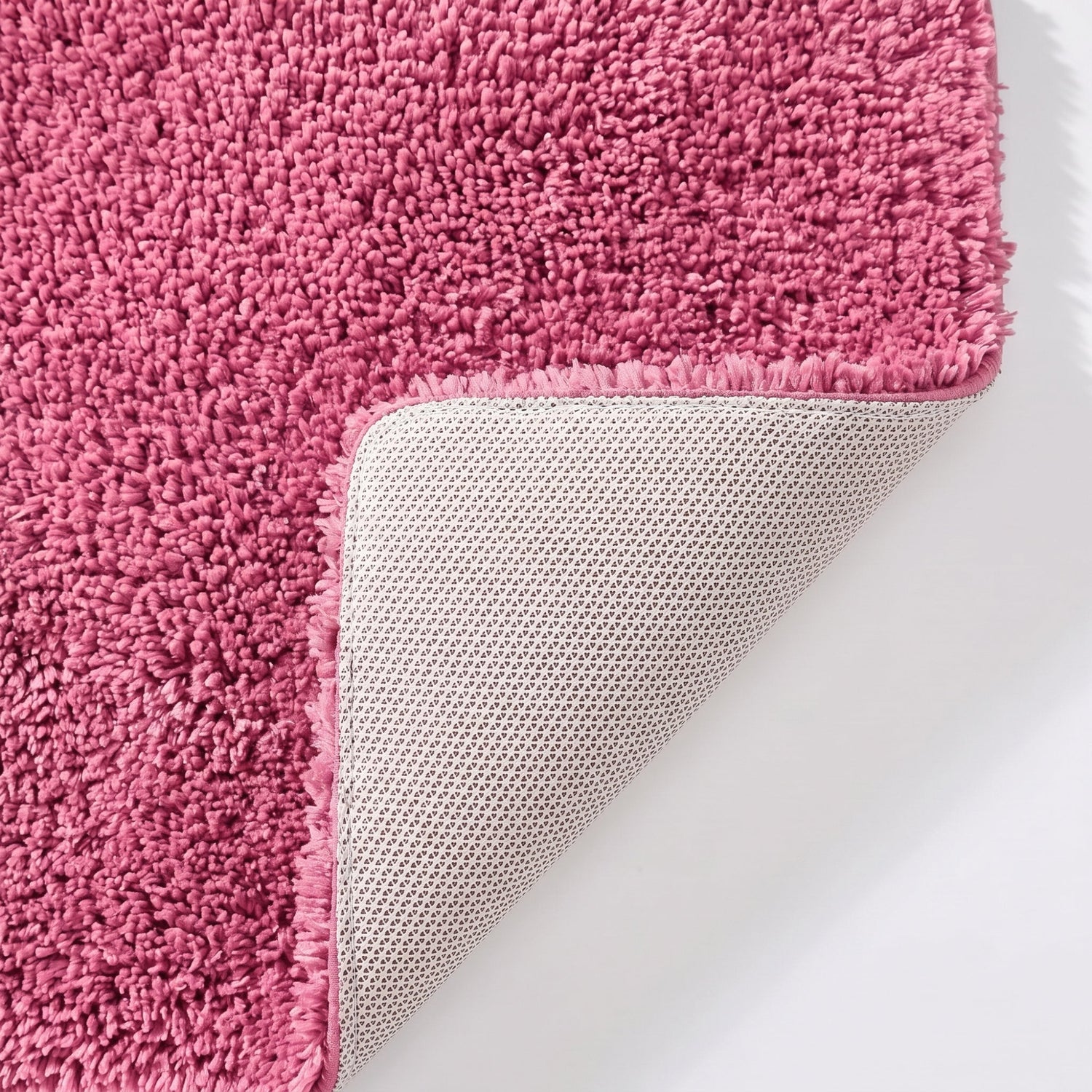 Rose pink non slip backing on a soft microfibre bath mat.