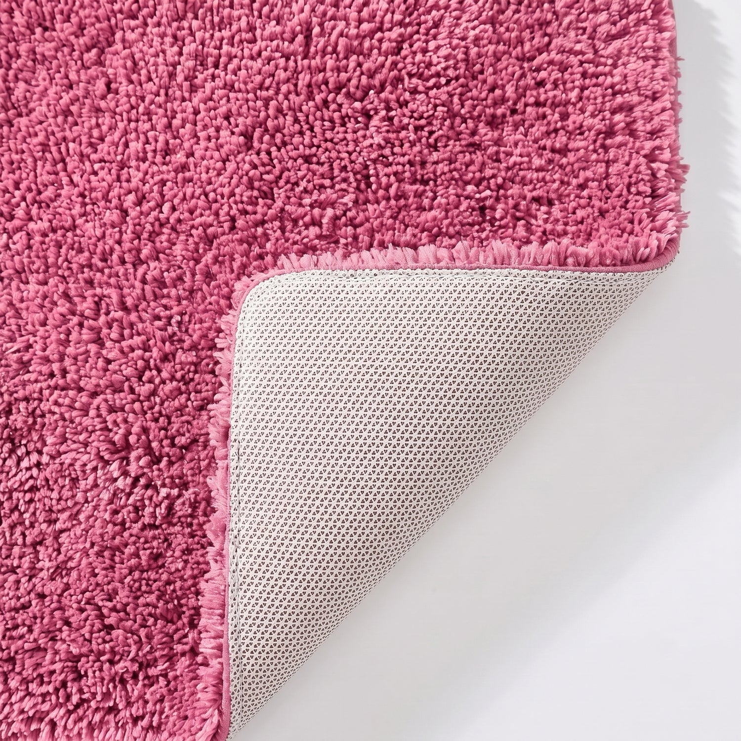 Rose pink non slip toilet pedestal mat with shaggy pile- 100% microfibre.