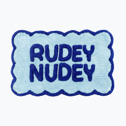 Cobalt blue and baby blue scalloped bathroom mat with rudey nudey slogan - fun dopamine bathroom.