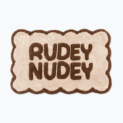 Chocolate brown and cream scalloped bath mat with slogan text - rudey nudey bathroom rug.