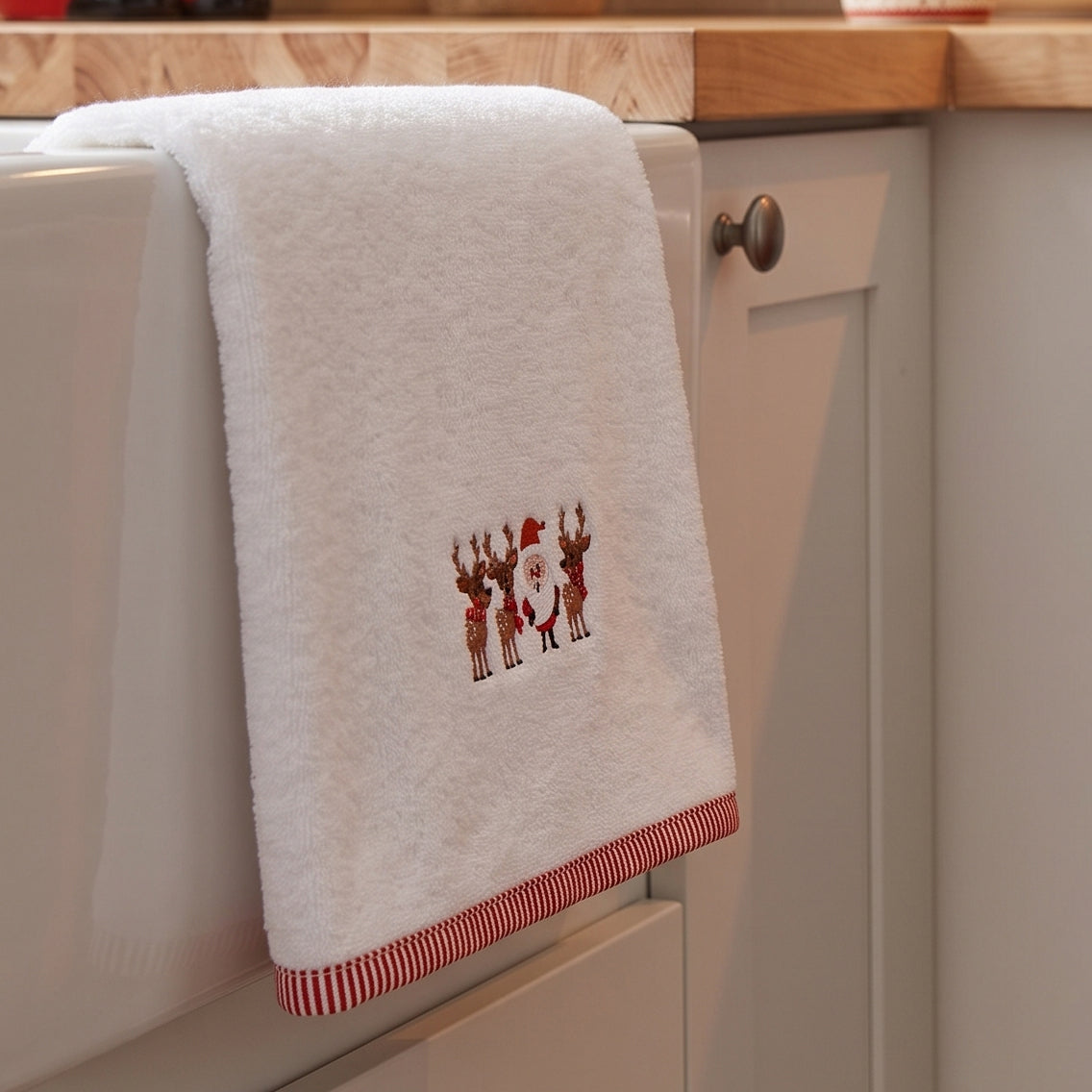 Christmas tea towel with santa and reindeer embroidery - festive kitchen decor.