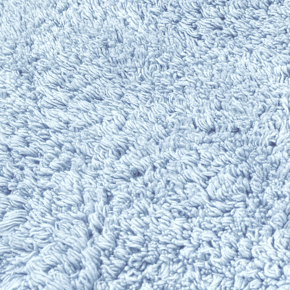 Baby blue cotton bath mats and shower mats.