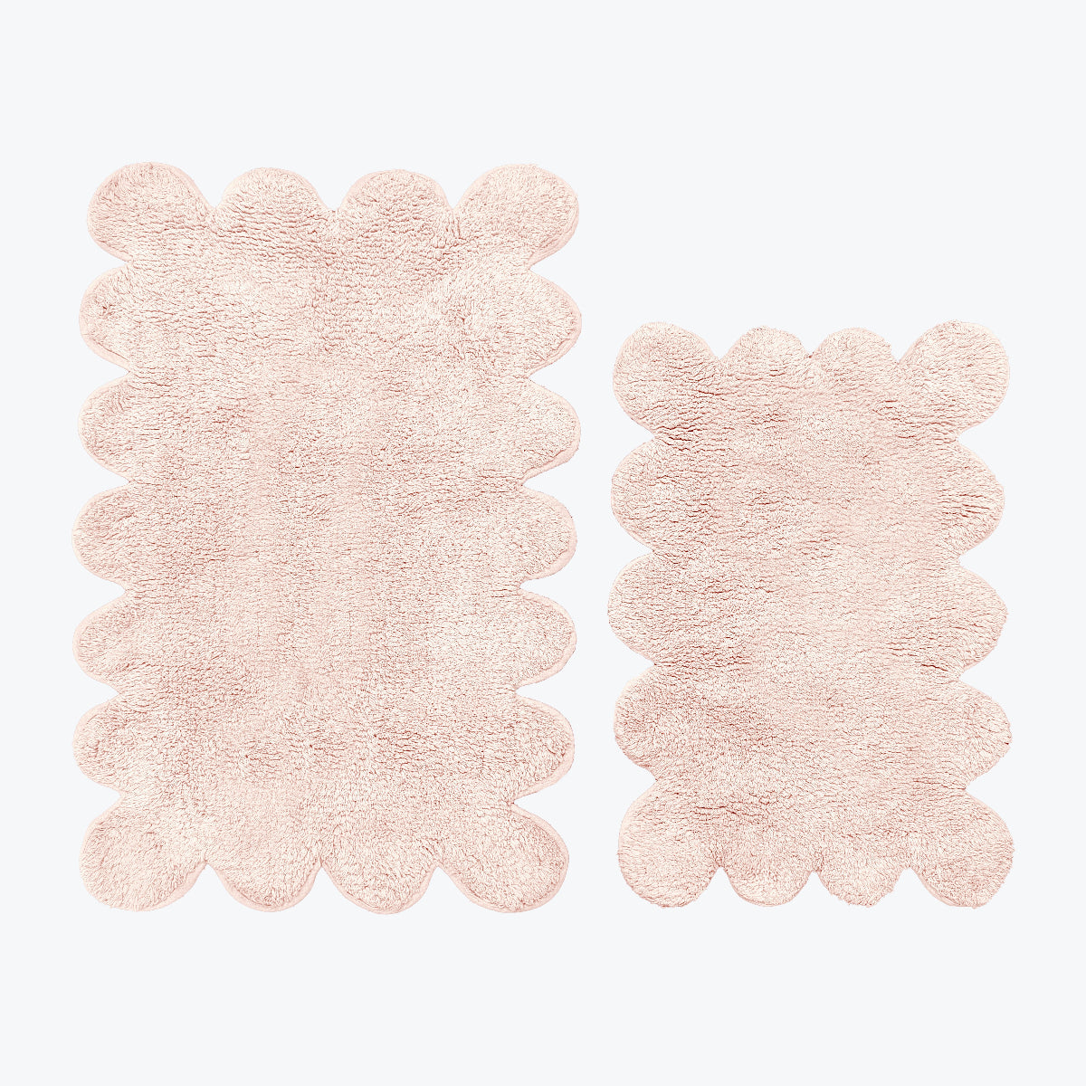 Blush pink scalloped bath mat set, two piece.