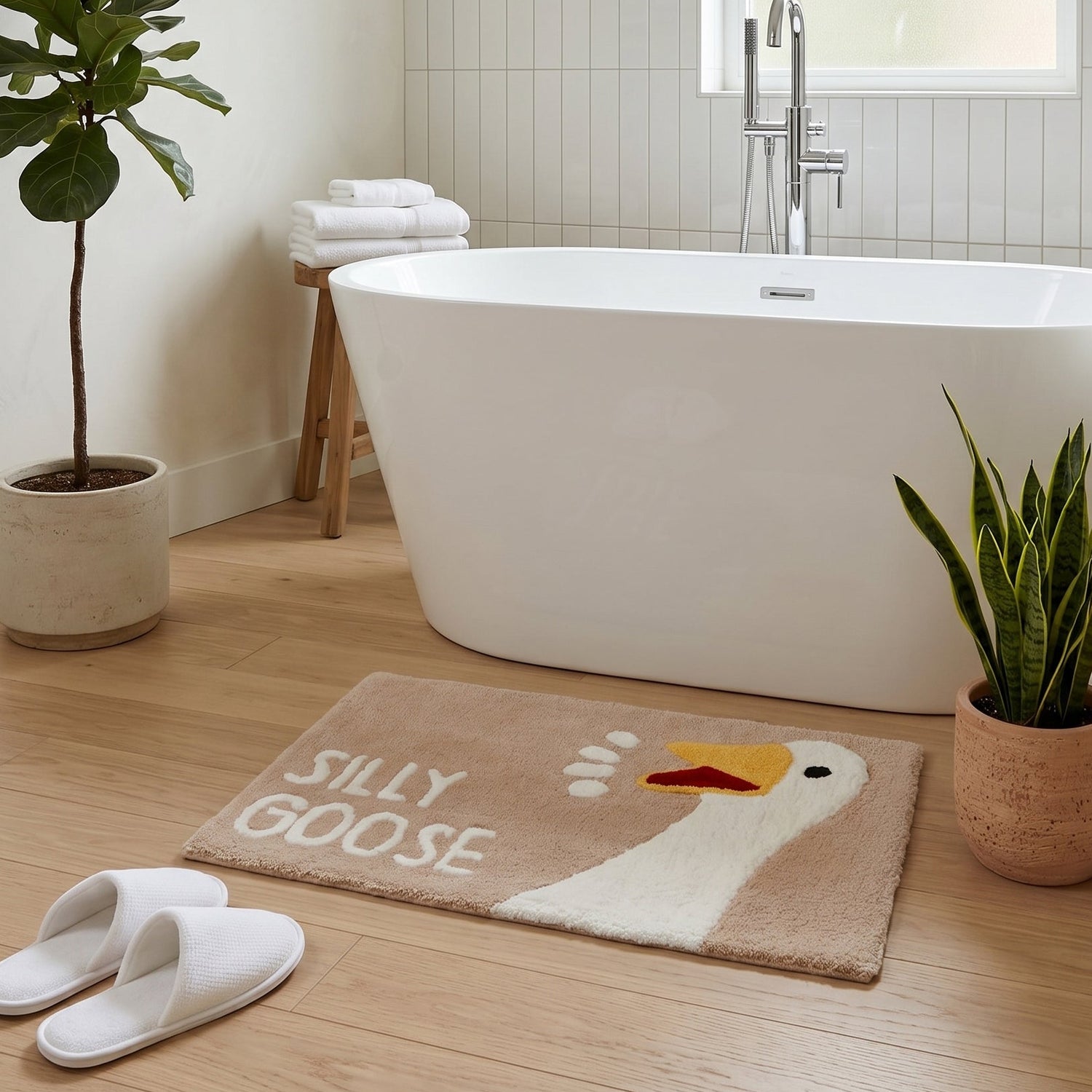 Beige neutral novelty bath mat with silly goose slogan and character.
