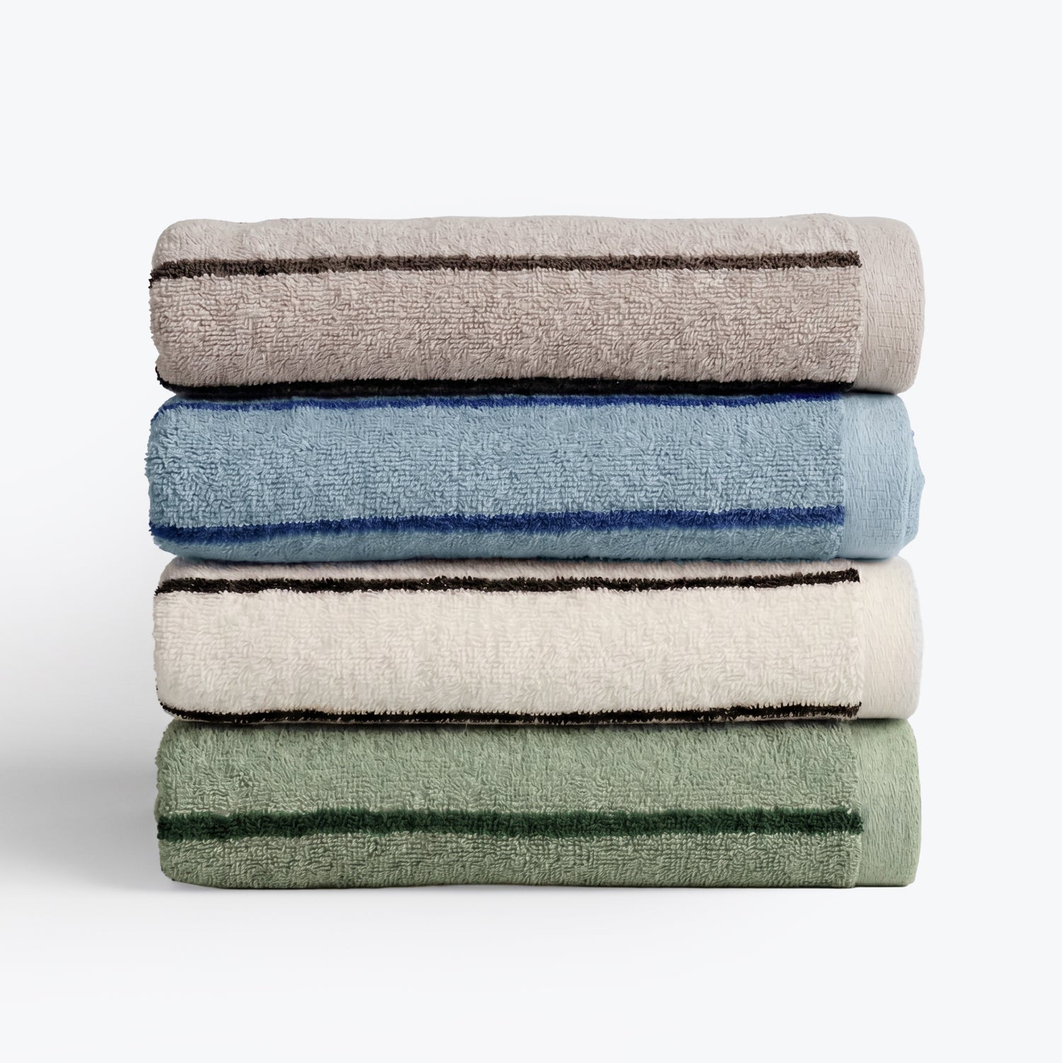 Stack of towels in mixed colours with striped pattern design, beige, blue, cream, green.