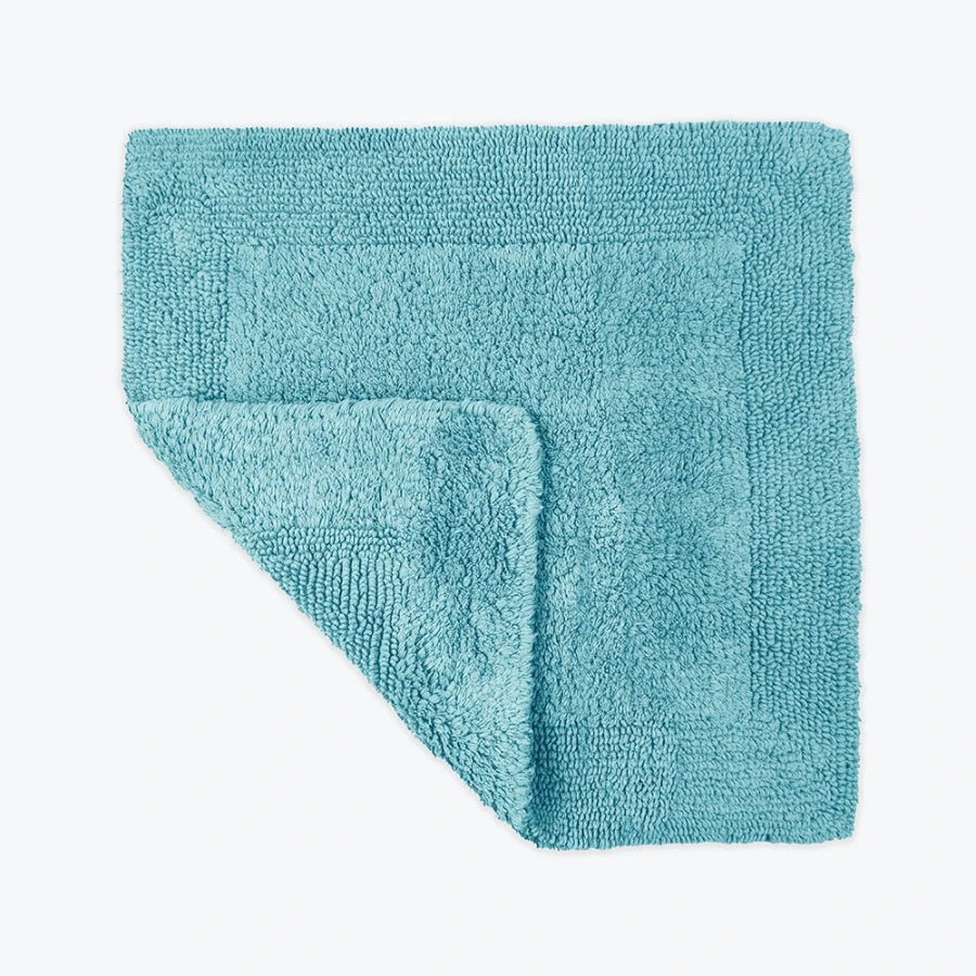 Turquoise square bath mat