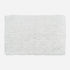 White cotton bath mat, tumble twist design.