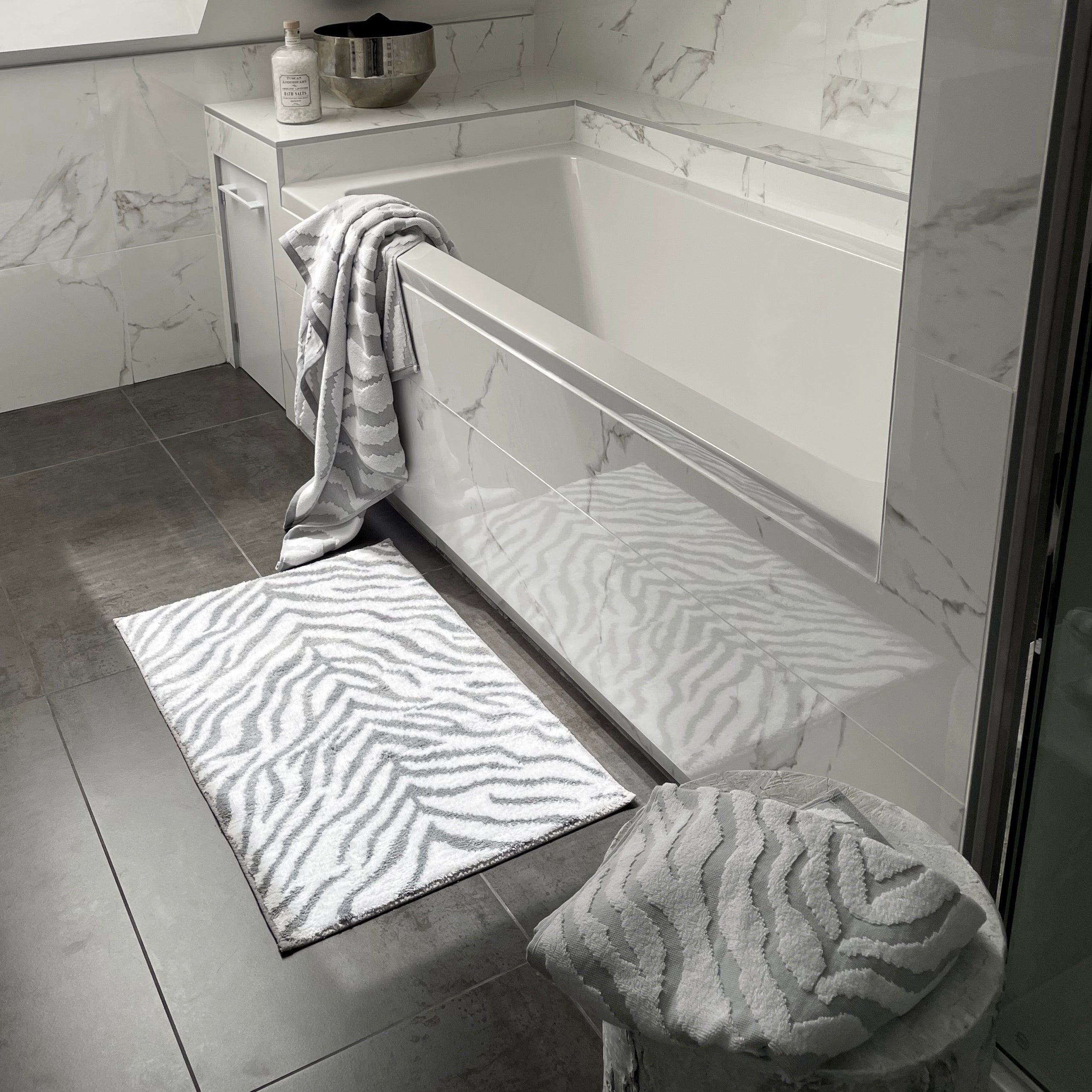 Zebra print bathroom mat and towels